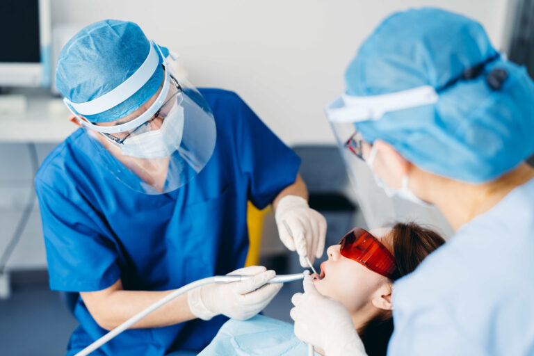 Asian young attractive woman during a dental check-up at the dentist.