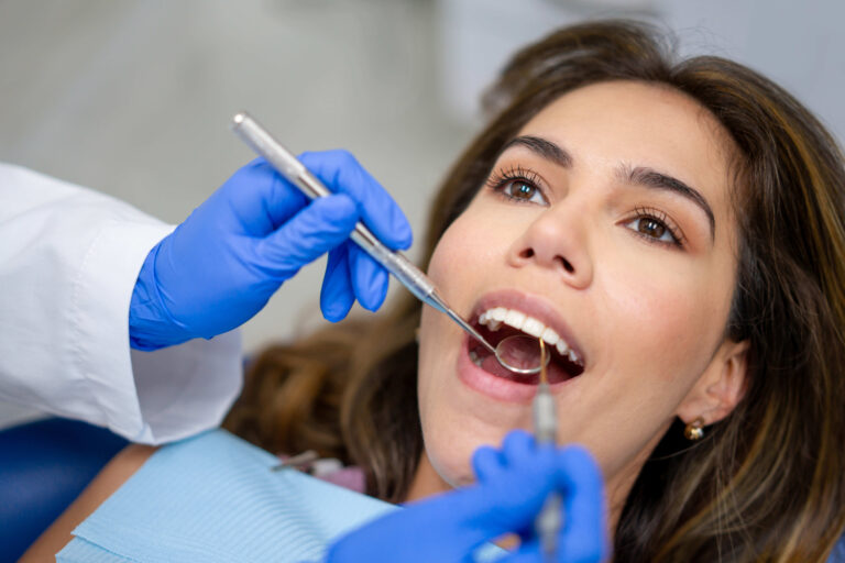Patient at the dentist getting her teeth cleaned